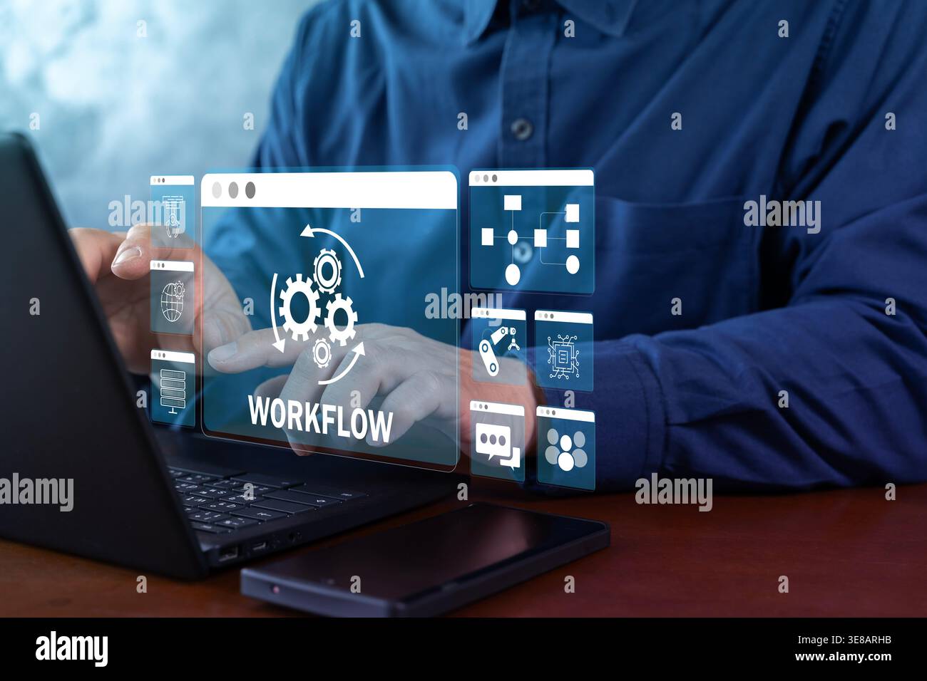 Hands operating a laptop with a virtual workflow interface, showing business process automation, task orchestration, system integration, and digital o Stock Photo