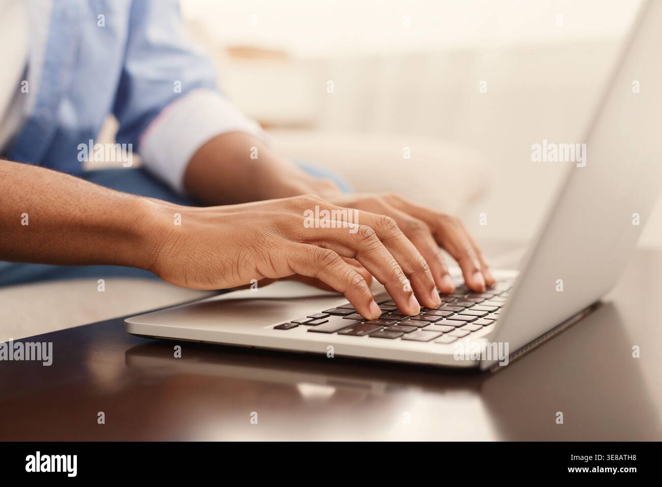 Male hands typing text or programming code on laptop Stock Photo