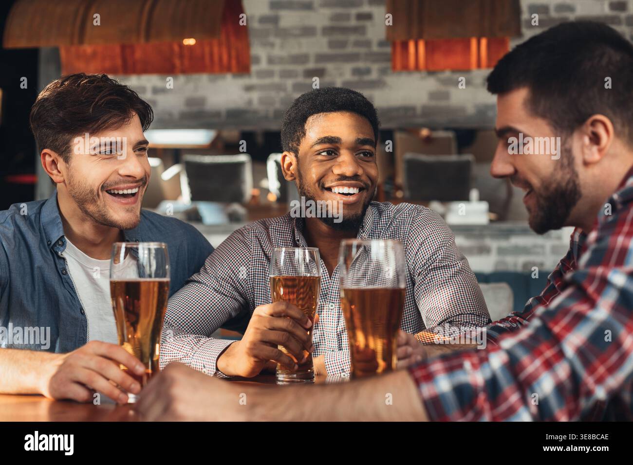 Beer Meating Best friends meeting and drinking beer in bar Stock Photo - Alamy