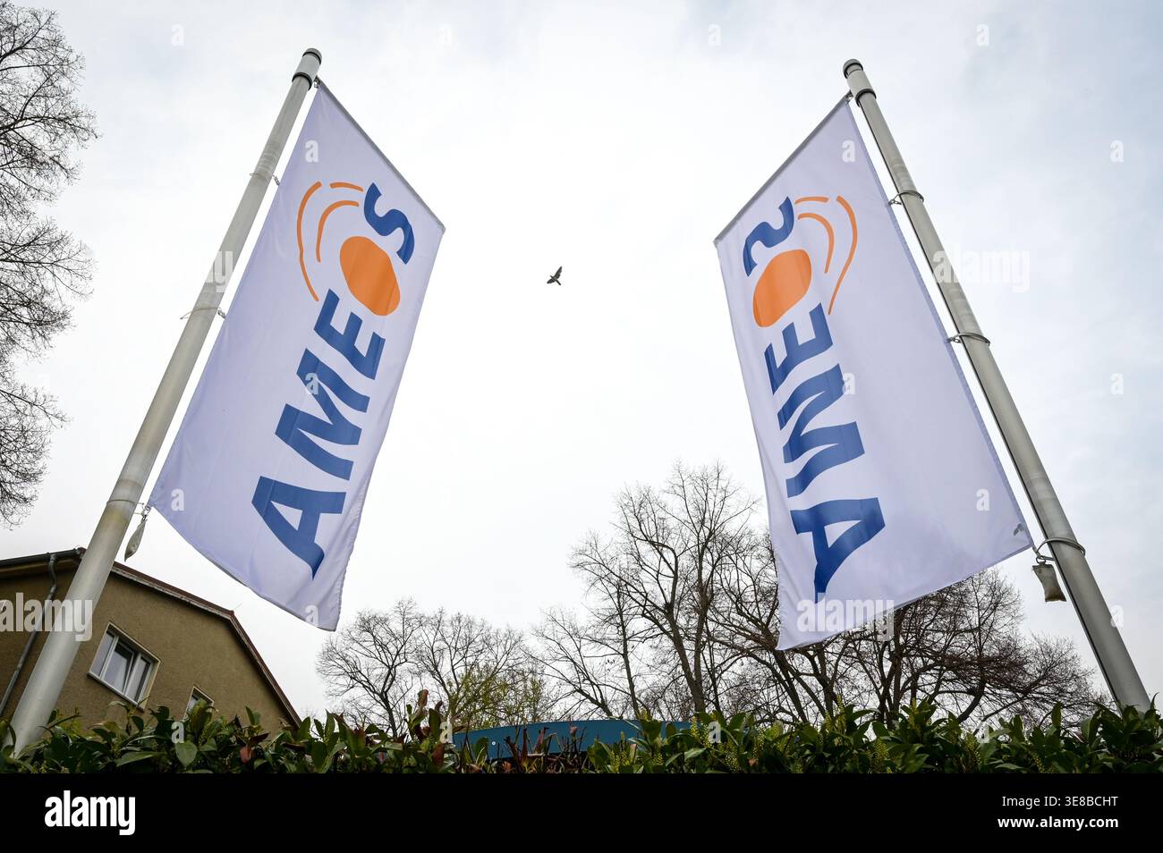 13 April 2026, Saxony-Anhalt, Aschersleben: Flags with the Ameos logo ...