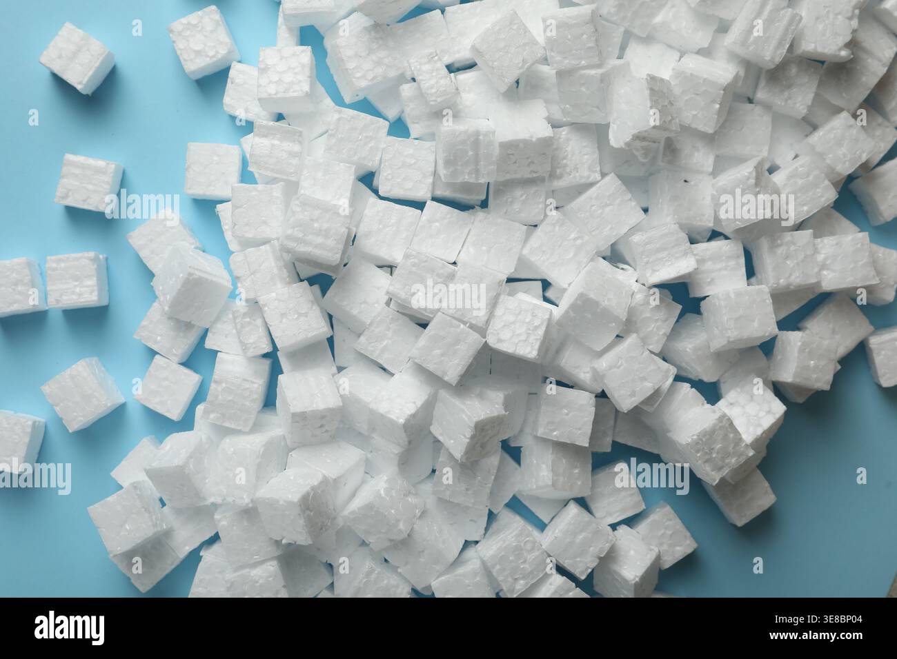 Many styrofoam cubes on light blue background, flat lay Stock Photo