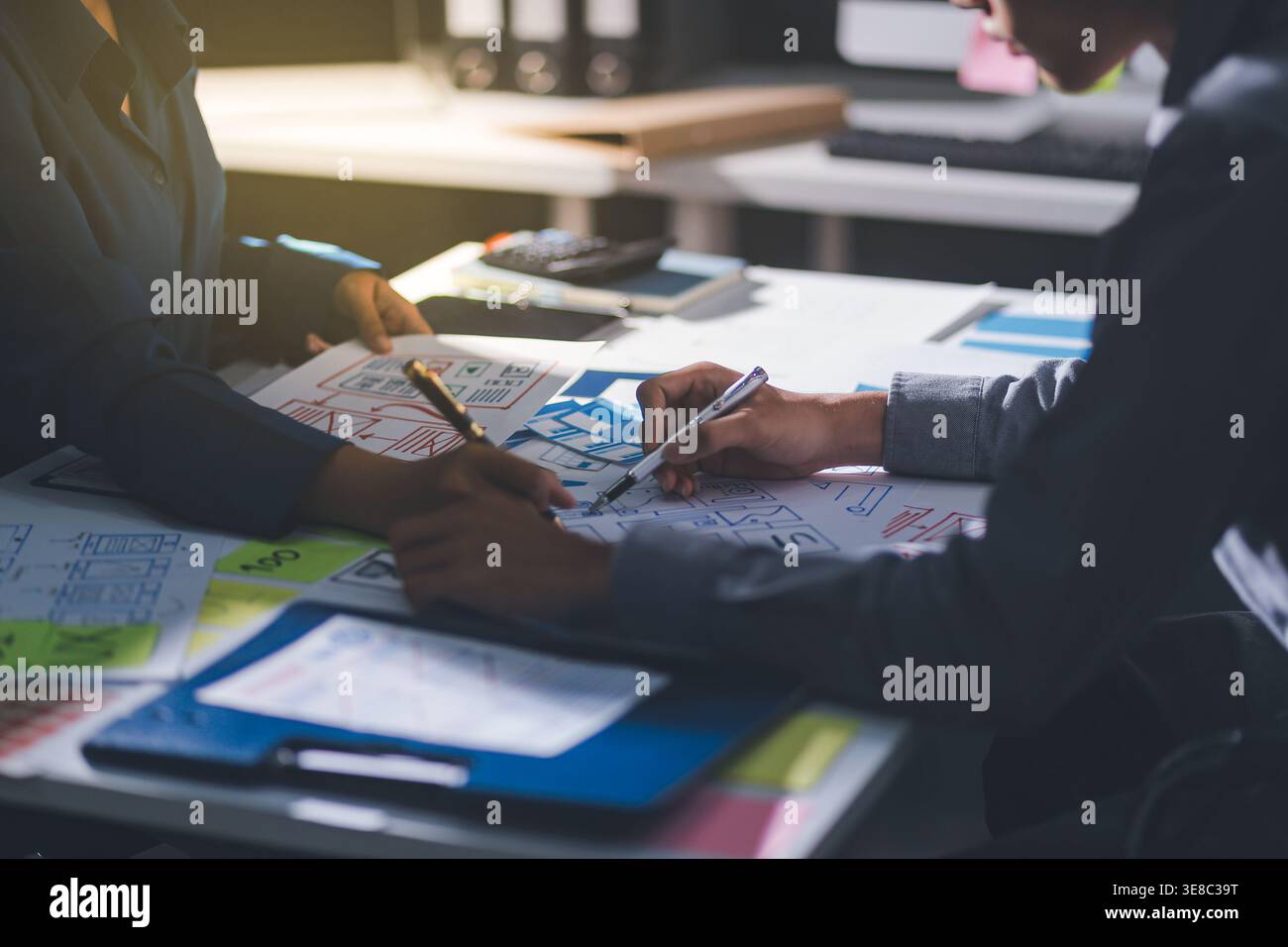 Team of Program Developer Collaborating on UXUI Design Planning in a Modern Office Environment Stock Photo