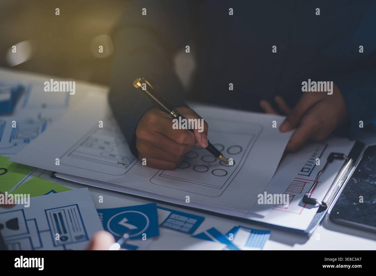 Team of Program Developer Collaborating on UXUI Design Planning in a Modern Office Environment Stock Photo