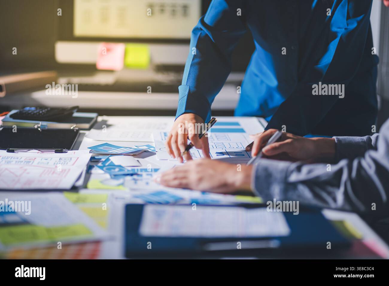 Team of Program Developer Collaborating on UXUI Design Planning in a Modern Office Environment Stock Photo