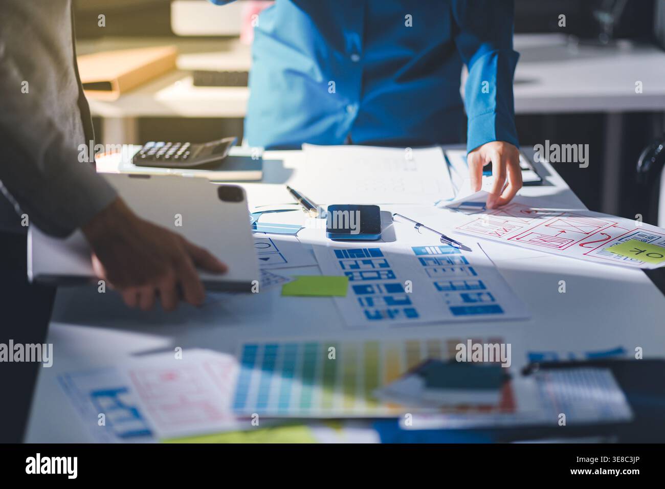 Team of Program Developer Collaborating on UXUI Design Planning in a Modern Office Environment Stock Photo