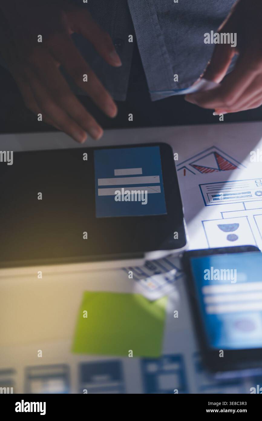 Team of Program Developer Collaborating on UXUI Design Planning in a Modern Office Environment Stock Photo