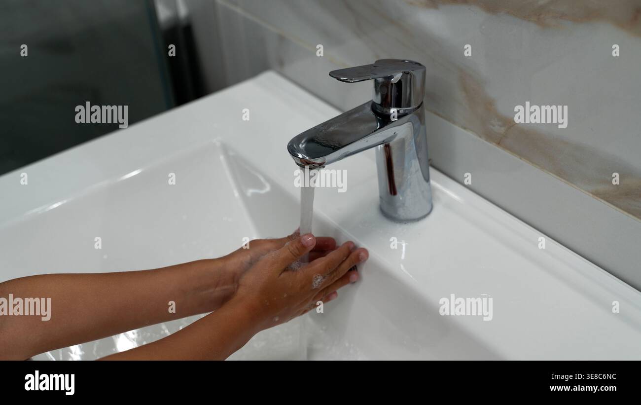Child washing hands under running water hygiene concept Stock Photo - Alamy