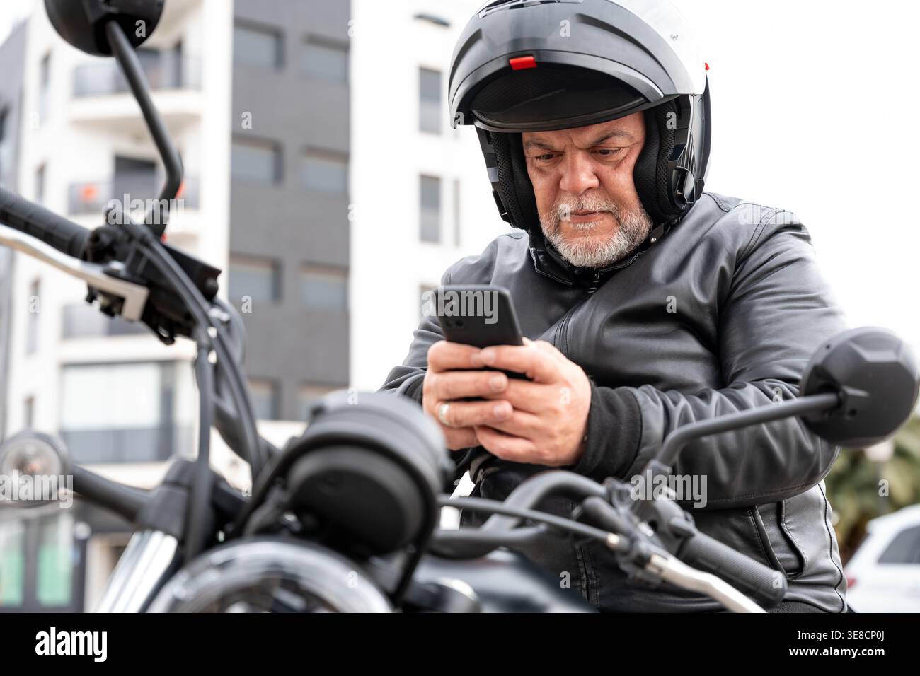 Older man wearing biker jacket hi-res stock photography and images 