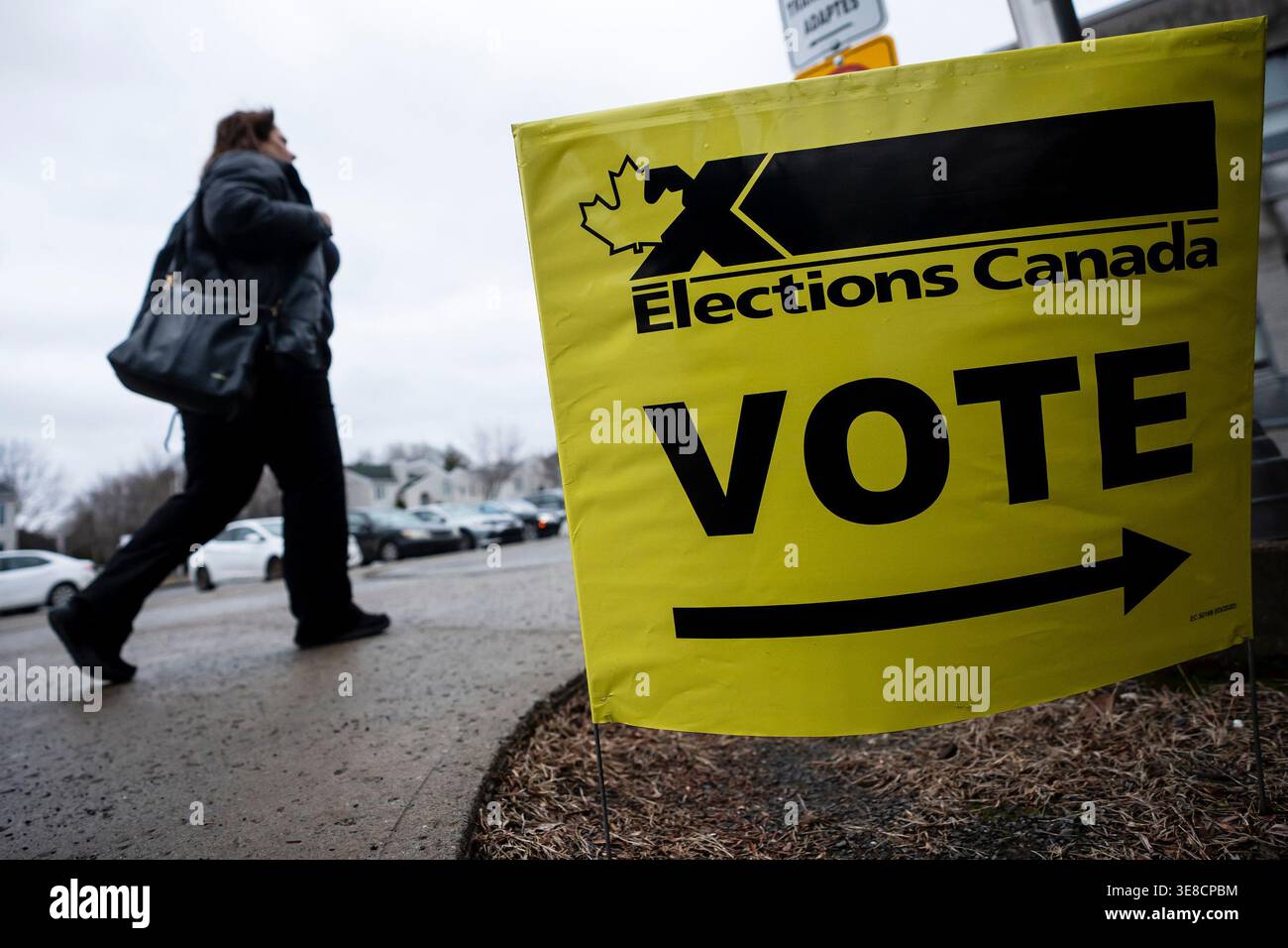 People enter an Elections Canada voting location, in Terrebonne, Quebec ...
