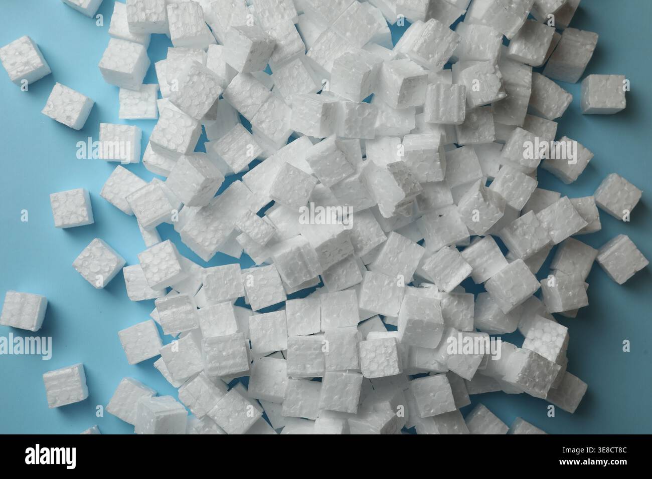 Many styrofoam cubes on light blue background, flat lay Stock Photo