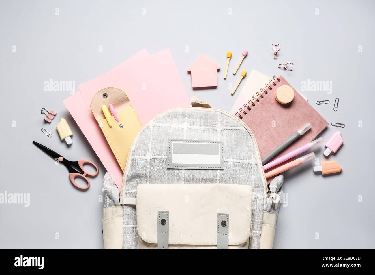 Stylish school backpack and different stationery on grey background Stock Photo