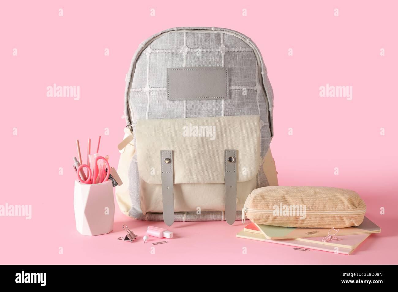 Stylish school backpack and different stationery on pink background Stock Photo