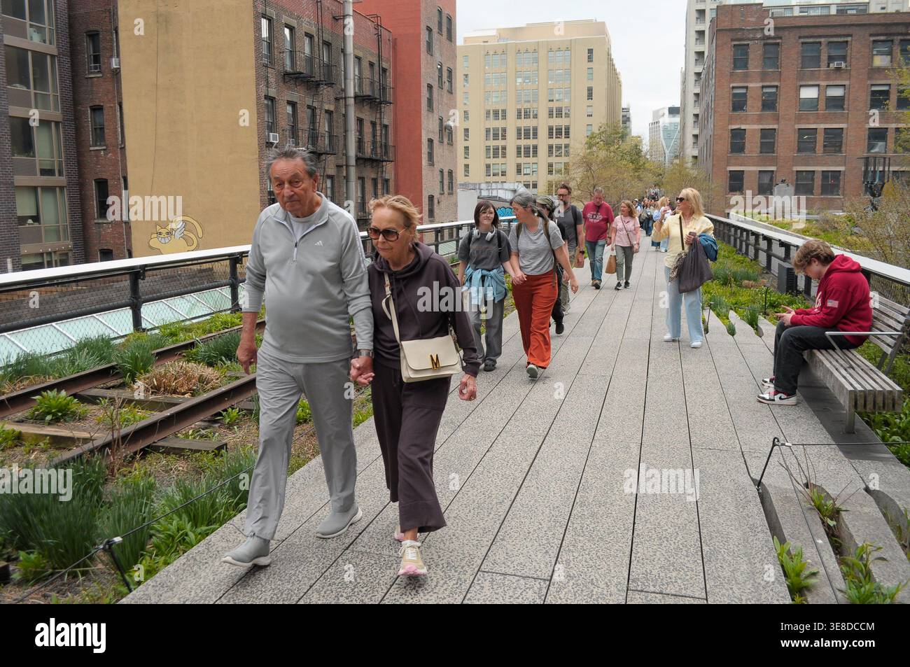 People walk on the High Line in Manhattan, New York City. (Photo by ...