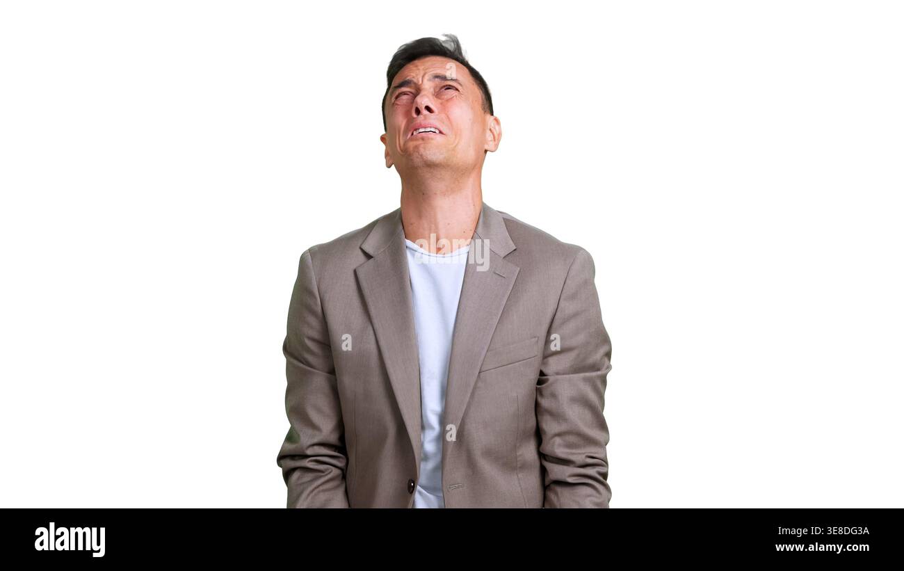 Business man expressing sadness and regret, looking up despairing Stock Photo