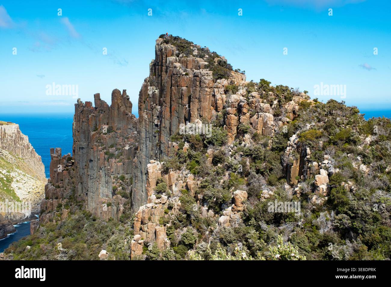 A lone hiker atop of The Blade, Three Capes Track, Tasman Peninsula, Tasmania, Australia Stock Photo