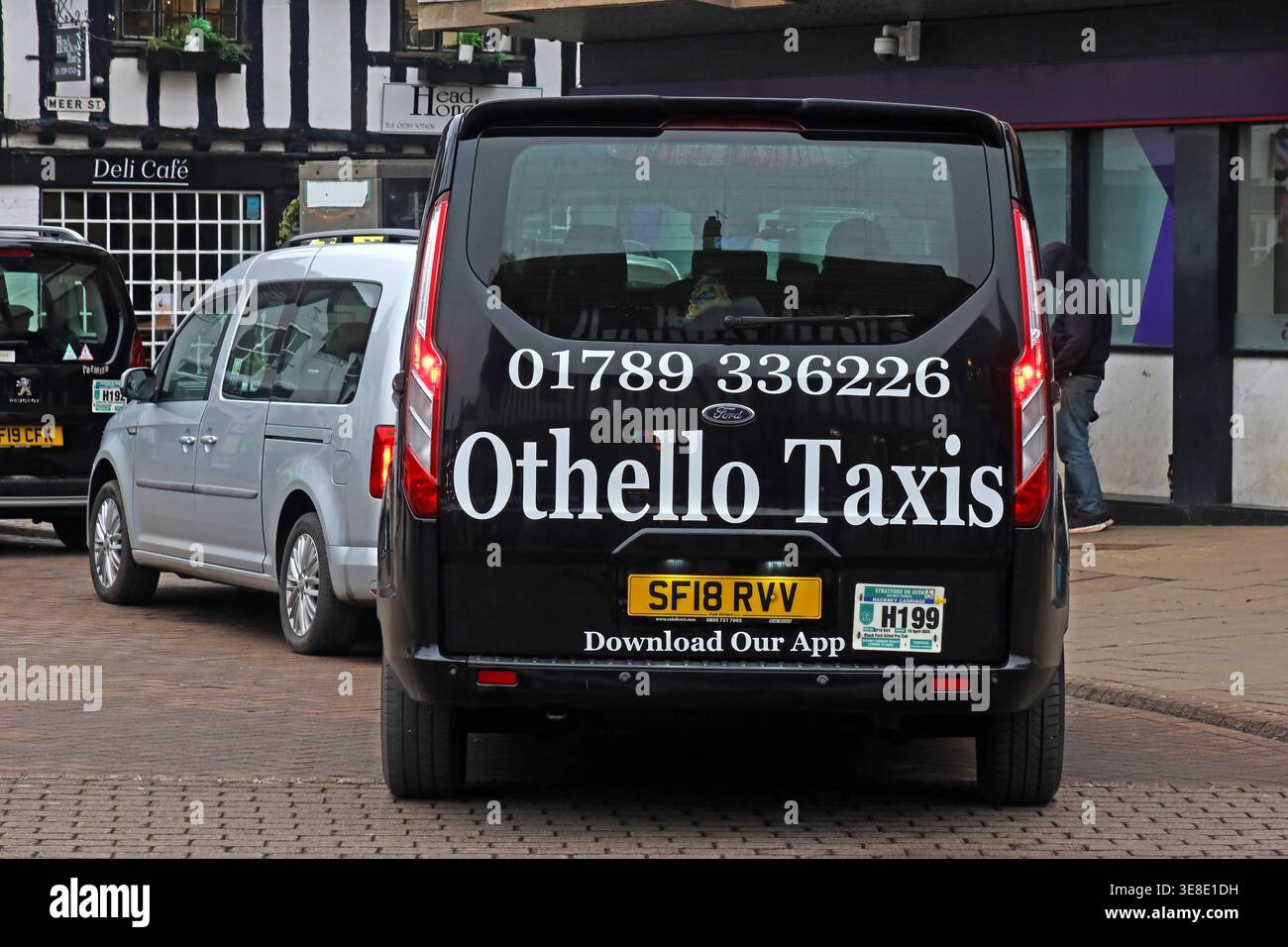 Othello Taxis vehicle in Stratford-upon-Avon town centre, using a Shakespeare-themed name in the playwright’s home town. Stock Photo