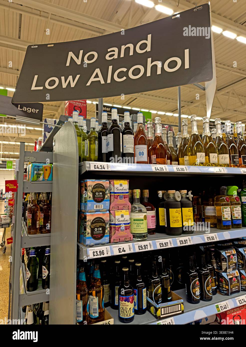 Asda supermarket No and Low Alcohol drinks aisle with beer, wine, spirits and cider alternatives on UK retail shelves, in Warrington, Cheshire, UK Stock Photo