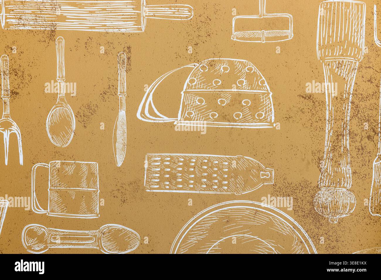 Hand drawn white sketches of various kitchen utensils and cooking tools on a textured brown wallcovering background. Stock Photo