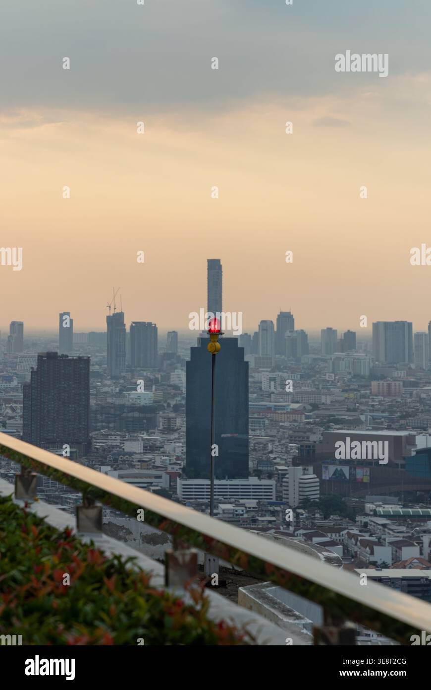 Bangkok, Thailand - Apr 5, 2022 - Atop a high-rise, a singular crimson ...