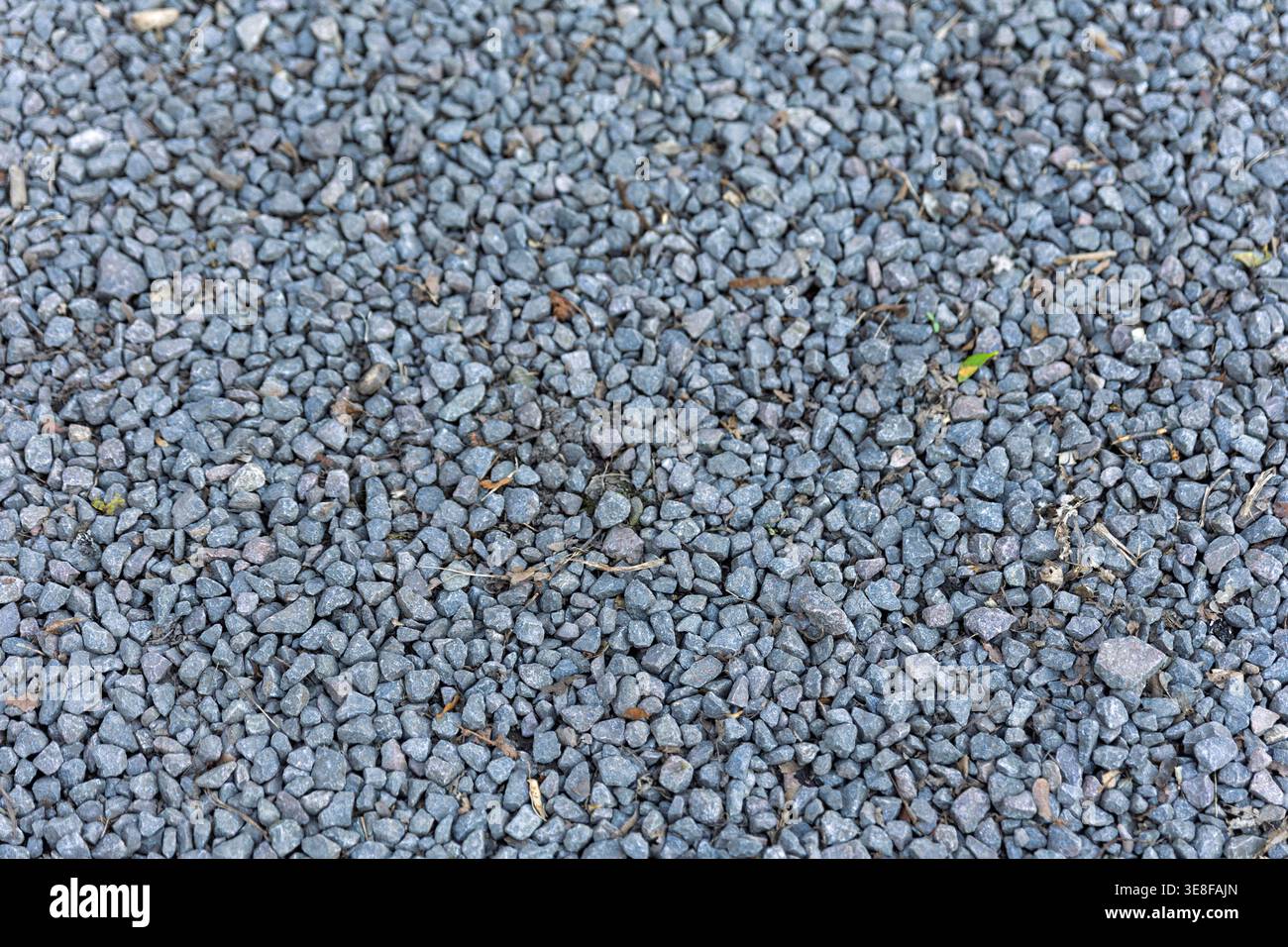 Background Texture of Grey Granite Gravel and Crushed Stone Stock Photo