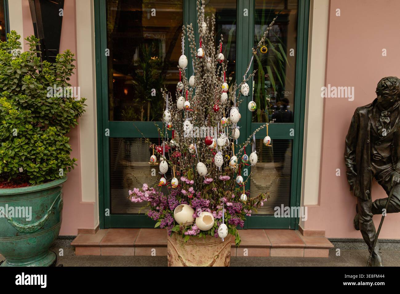 Decorated Easter Egg Tree Outside Green Door Stock Photo