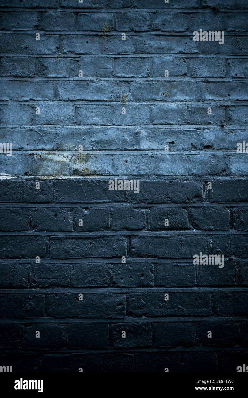 Two-tone dark painted brickwork Stock Photo