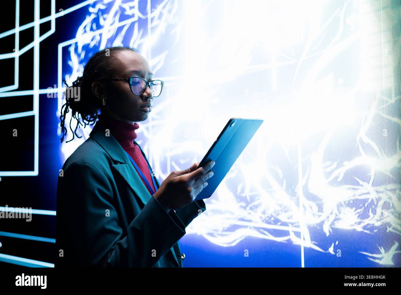 Software developer seeing autonomous AI agent writing complex code on digital videowall. Close up of system administrator tracking self generating artificial intelligence architecture on tablet Stock Photo