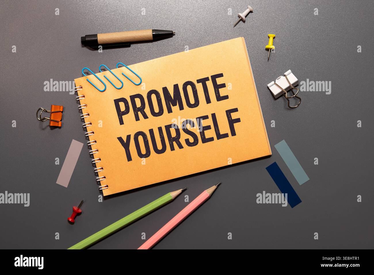 PROMOTE YOURSELF text written on a notebook with chart Stock Photo