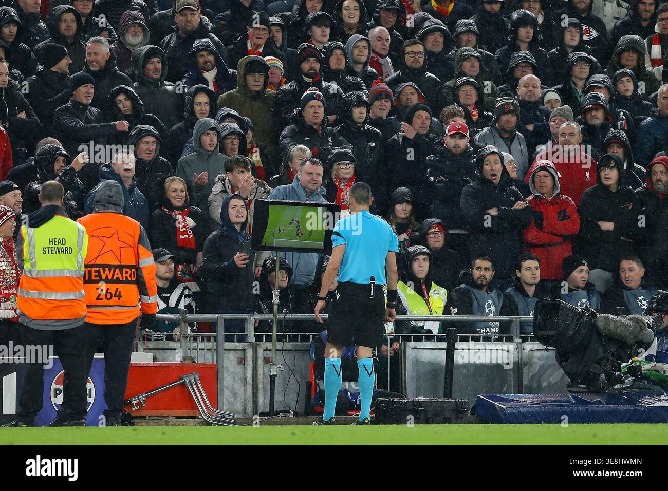 Referee Maurizio Mariani checks the VAR screen for a possible penalty ...