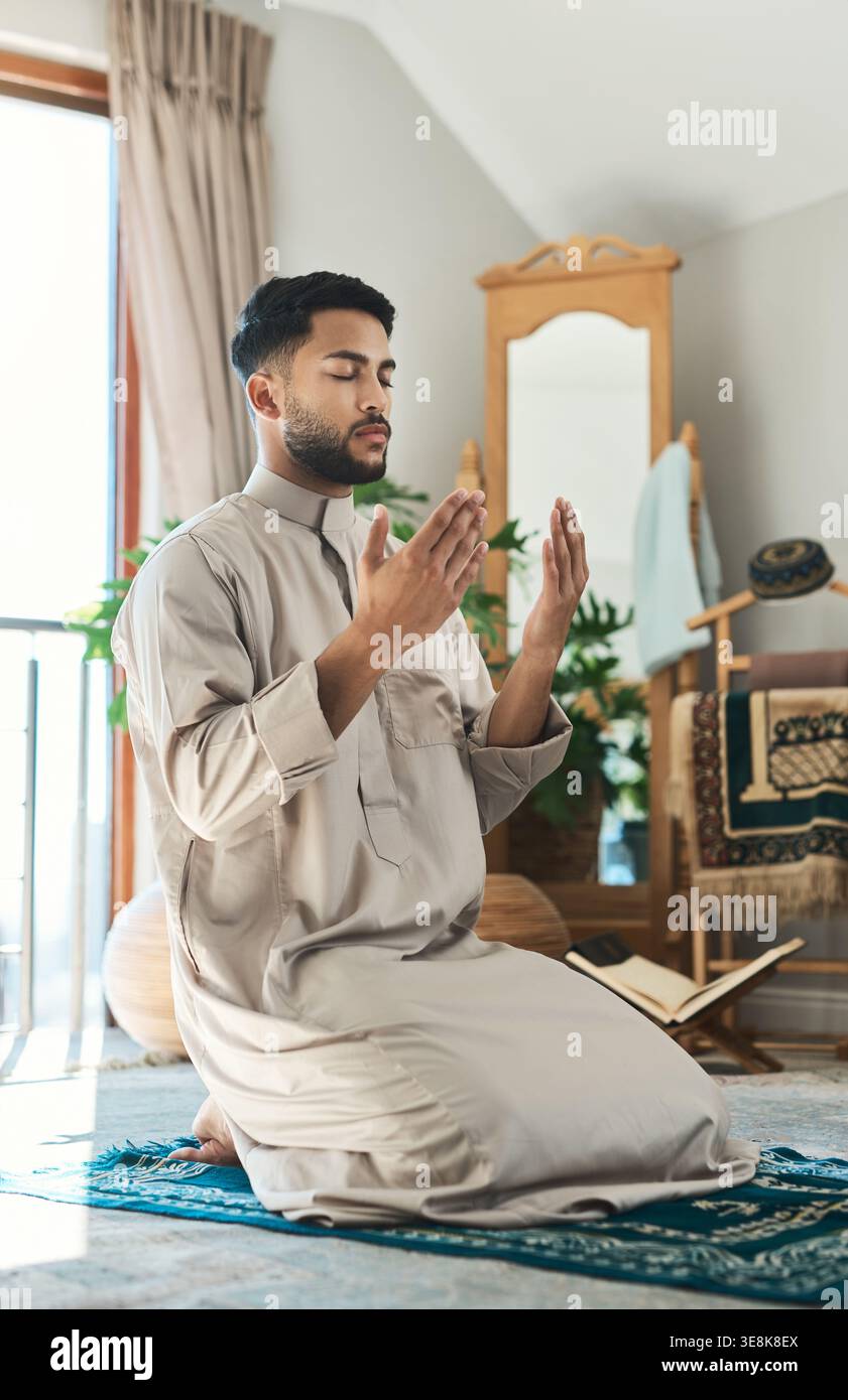 Muslim man on prayer mat hi-res stock photography and images - Alamy