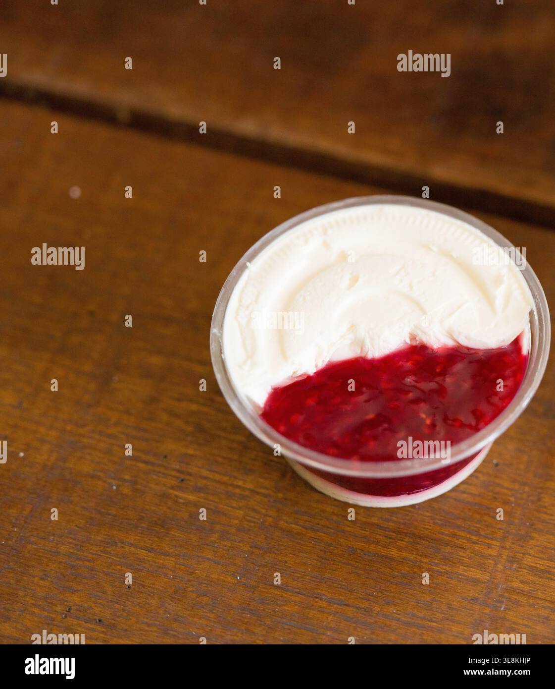 Cream Cheese Isolated Detail Crop from Bagel Plate with Cream Cheese Raspberry. This image features cream cheese, raspberry jam, condiment cup. Freshl Stock Photo