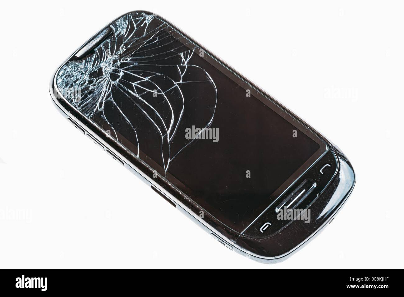 Broken smartphone with shattered glass screen on white background Stock Photo