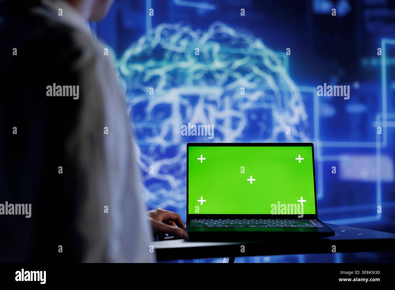 Admin using mockup device for artificial intelligence computing simulating human brain through self learning algorithms. Employee with isolated screen laptop, working with AI deep neural networks Stock Photo