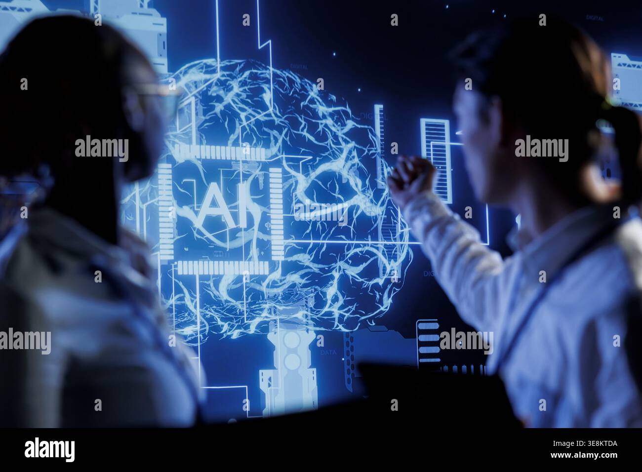 Computer scientists brainstorm ways to use AI cognitive computing to extract usable information from complex data. Data center employees implement artificial intelligence to process massive datasets Stock Photo