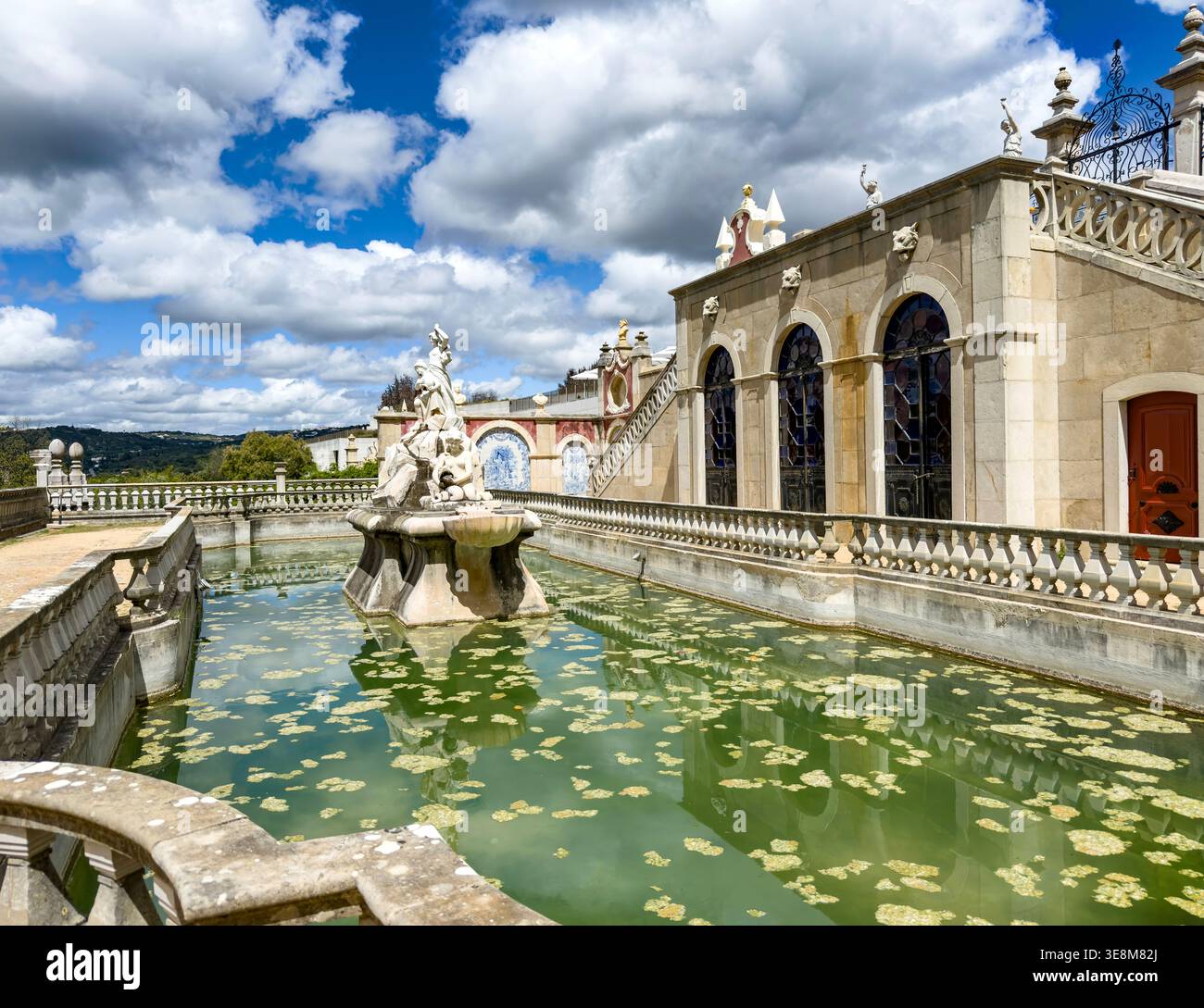 Fountain and pool in the historic gardens of Palacio de Estoi with blue azulejo tiles in Faro, Algarve region of Portugal Stock Photo