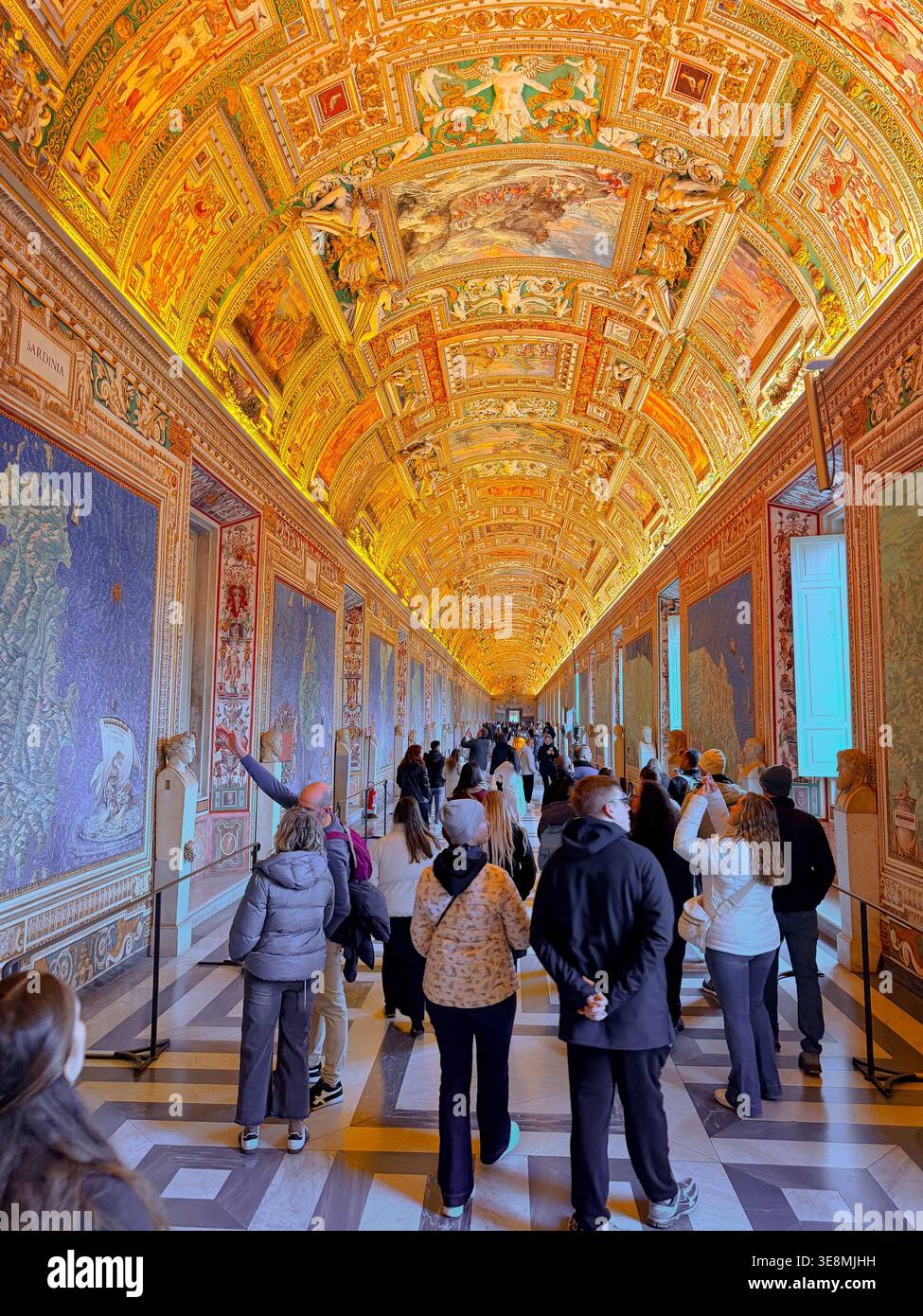 People looking at the exhibits in The Gallery of Maps (Galleria delle carte geografiche) in the Vatican Museums Stock Photo
