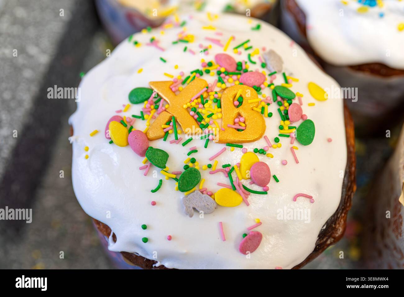 Traditional Easter Cake Paska with White Glaze and Golden Letters XB Stock Photo