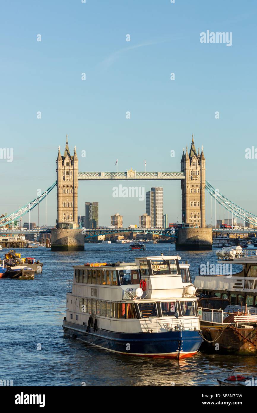The Tower of London illuminated by late afternoon light seen from the River Thames, London Stock Photo