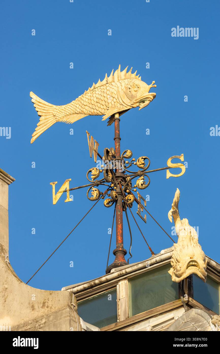 A decorative weather vane in the shape of a fish, located on the roof of the Old Billingsgate Market building in London Stock Photo