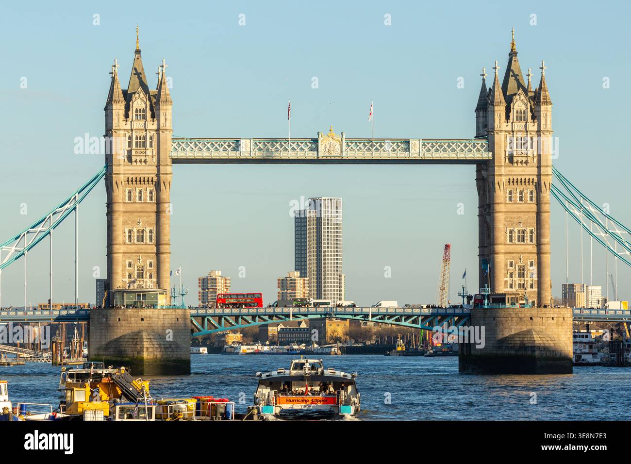 The Tower of London illuminated by late afternoon light seen from the River Thames, London Stock Photo