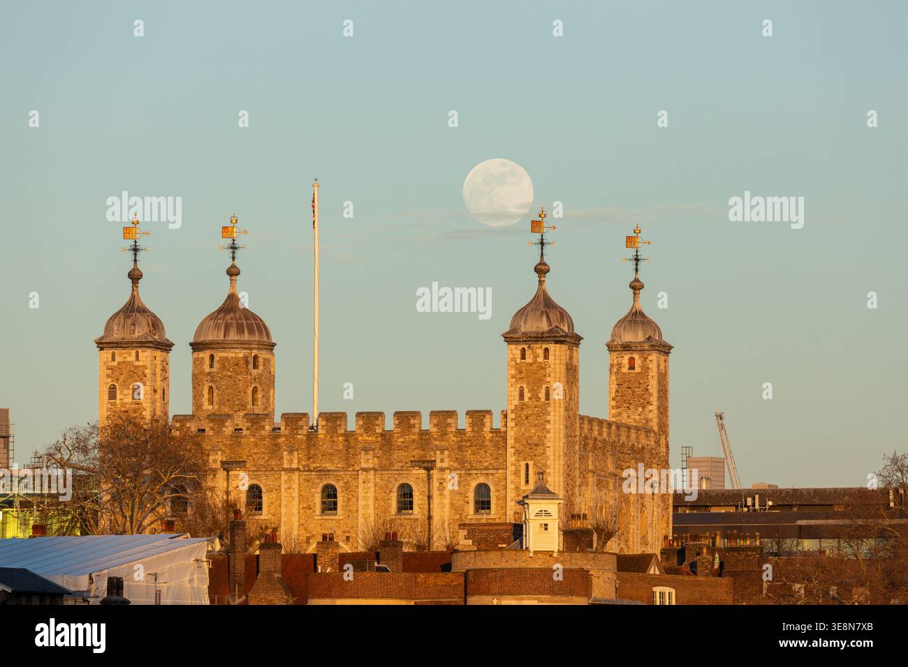 Moonrise over the Tower of London, a historic landmark in central London, England Stock Photo
