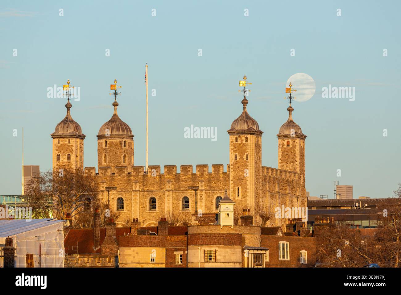 Moonrise over the Tower of London, a historic landmark in central London, England Stock Photo