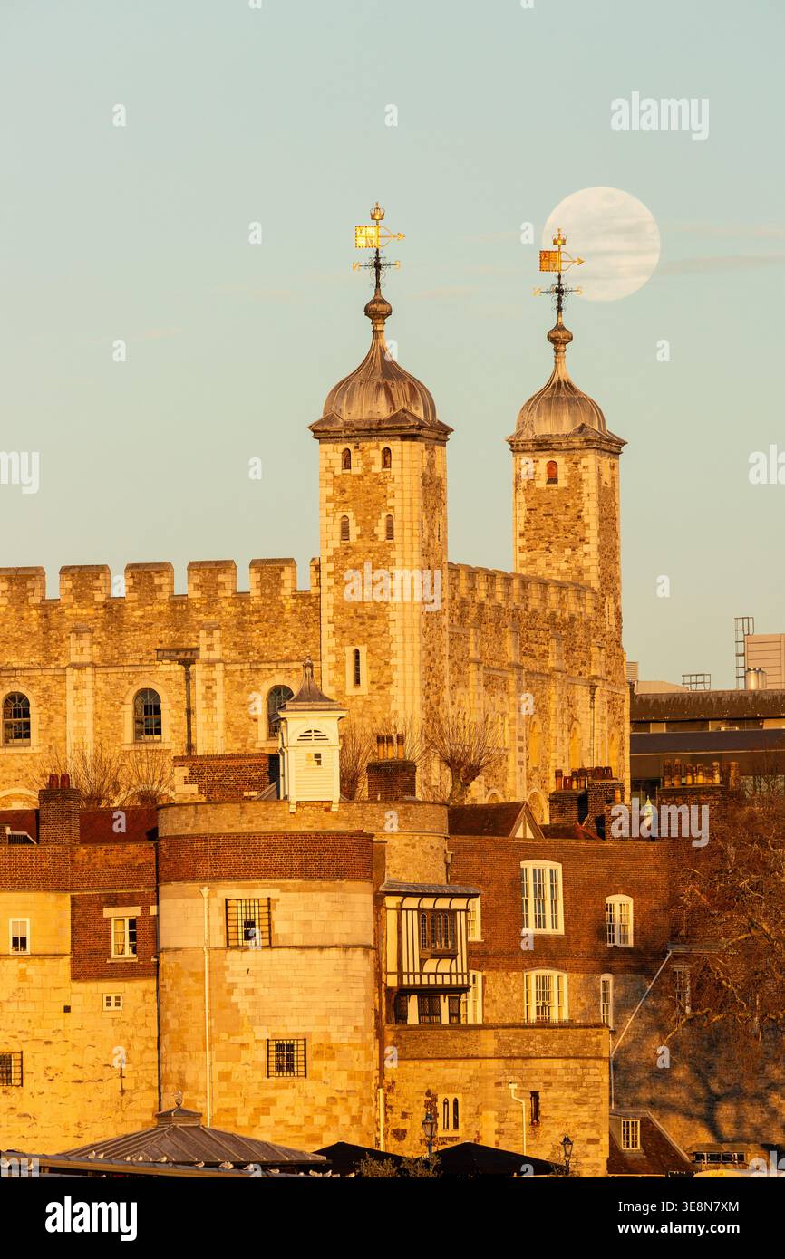 Moonrise over the Tower of London, a historic landmark in central London, England Stock Photo