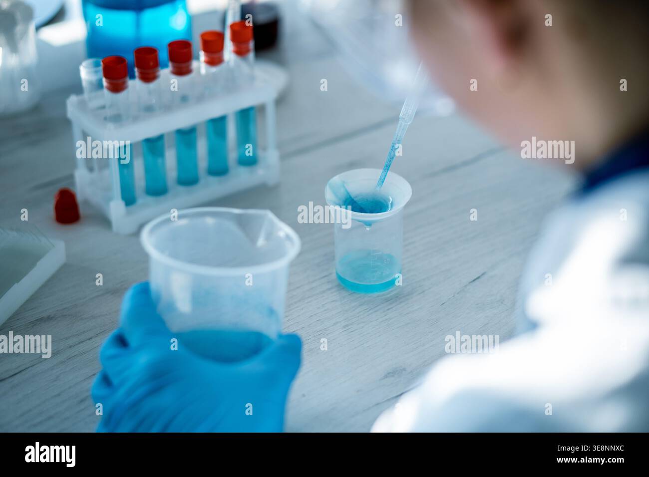 Conducting analysis blue chemical solution hi-res stock photography and ...