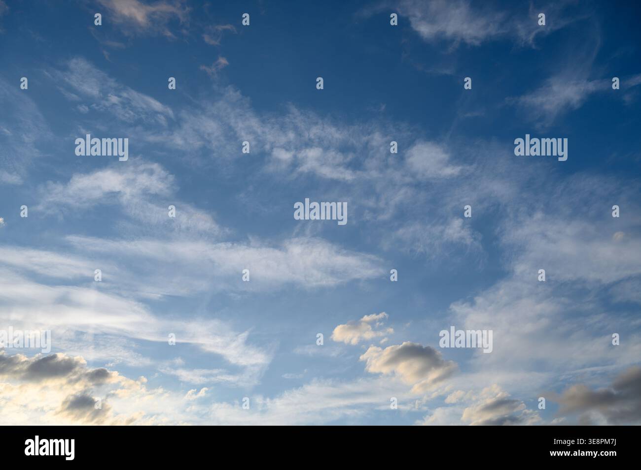 Cirrus and Cumulus Cloudscape Over Open Landscape Stock Photo