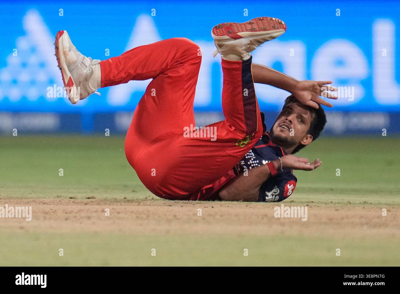 Royal Challengers Bengaluru's Rasikh Dar falls in his follow-through ...