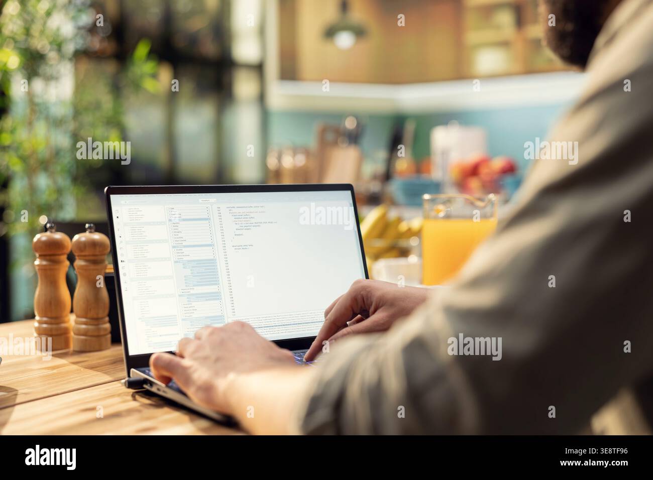 Adult programmer, developing web code, software systems on laptop, coding, debugging, data analysis, UX processes, and global network connectivity. Remote work in technology, high-tech. Stock Photo