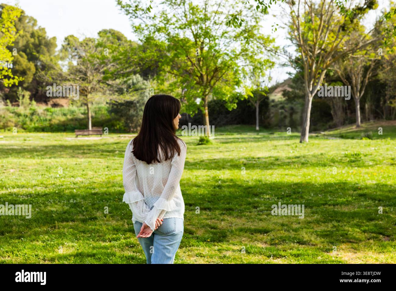 Woman outdoors in green park hi-res stock photography and images - Alamy