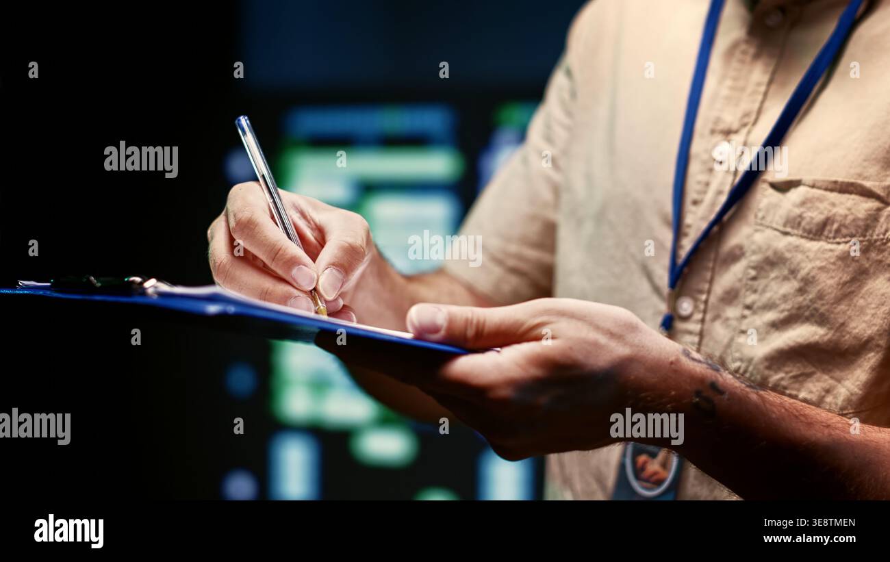 Skillful technician walking in high tech facility supporting AI through high performance computing. IT specialist making sure server hub electronics are in working condition, close up Stock Photo