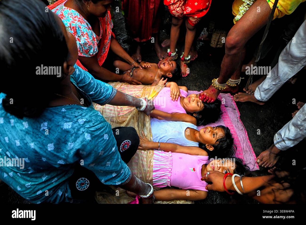 Kids seen lying on the street while the devotees step on them during ...